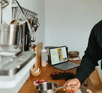 a man standing in a kitchen preparing food