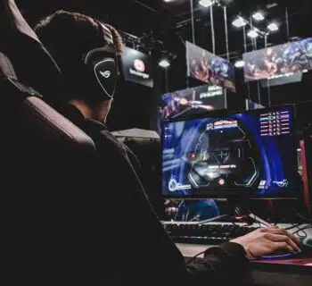 person sitting on gaming chair while playing video game